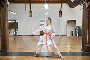 Side view of young woman in combative position