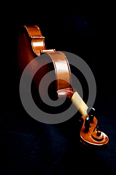 Side violin on black background