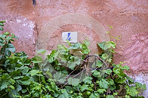 Side wall of a house with the number 4 photo