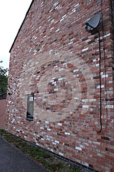 Side wall of modern house with different coloured bricks