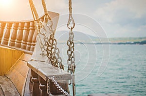 Side of a wooden pirat ship with vintage rigging. Tourist trip on the Sea