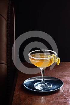 Sidecar Cocktail with Sugared Rim in Dark Bar