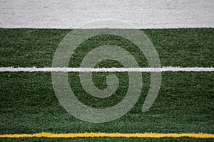 Sideline painted markings on a football field with no people or equipement in shot