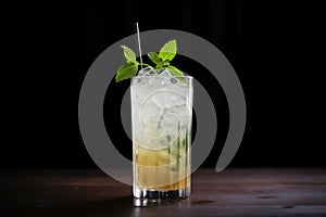 sidelit mojito with deep shadows on a black surface