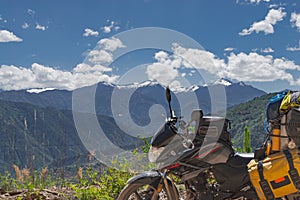 Sideview of touring Motorcycle stopped at the mountain peak