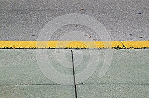 Sidewalk background with yellow curb