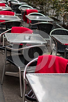 Sidewalk cafe with plastic wicker chairs