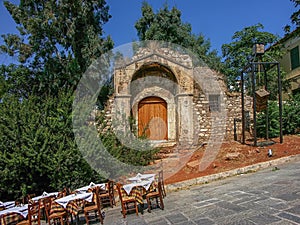 Sidewalk cafe on a steep pavement photo