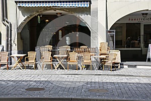 Sidewalk cafe under arcades