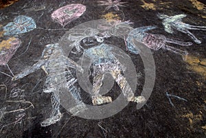 Sidewalk chalk of happy kids photo