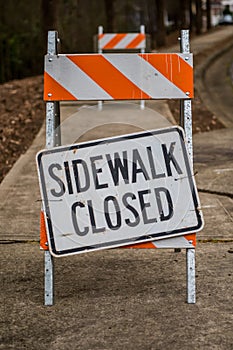 Sidewalk Closed Sign Askew on Stand Full Frame