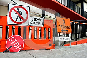 Sidewalk Closed signs for works. Stop and Detour signs