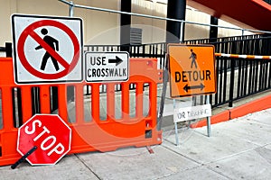 Sidewalk Closed signs for works. Stop and Detour signs