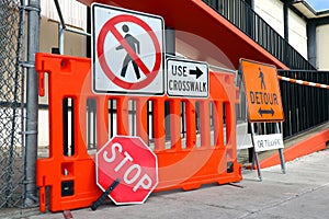 Sidewalk Closed signs for works. Stop and Detour signs