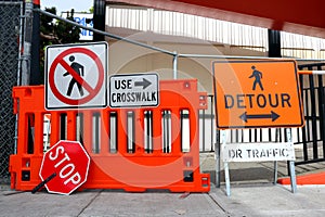 Sidewalk Closed signs for works. Stop and Detour signs