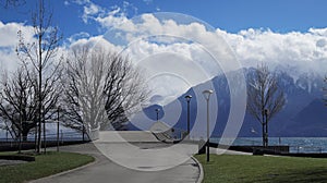 sidewalk of the park next to the sea and in front of the snowed mountains, Vevey, Sweden