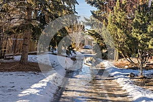 Sidewalk spring snow melt