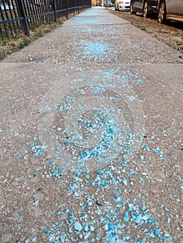 Sidewalk Sprinkled With Blue Rock Salt To Prevent Slipping In Case Of Snow Or Ice