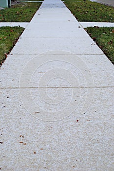 Sidewalk with an untouched dusting of snow