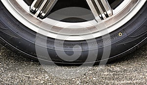 Sidewall of the  car tire with a low tire pressure photo