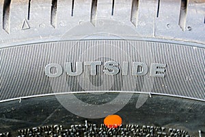 Sidewall of a passenger car tire with an outer side marking