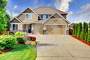 Siding house with stone trim and tile roof