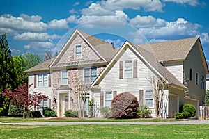 Siding and Stone House in Spring