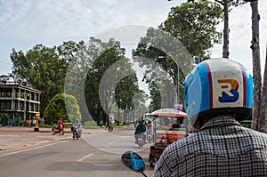 Siem Reap, Cambodia - August 3th, 2016: The tuk-tuk car driver, fast, not expensive, and convenient.