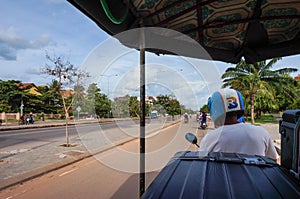 Siem Reap, Cambodia - August 3th, 2016: The tuk-tuk car driver, fast, not expensive, and convenient.