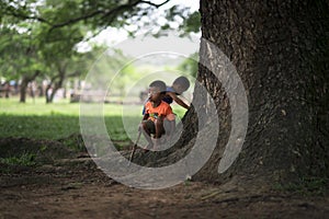 Siem Reap, Cambodia - 08 08 2014: Cambodian kids playing in the jungle at Angkor Wat, Cambodia