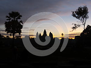 Silhouette of Angkor Wat - famous Cambodian landmark - on sunrise.