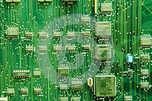 Siemens circuit pack, green computer board background. Telephone electronic circuit with transistors photo