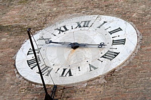 Siena, Italy. Old clock on the wall