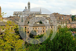 Siena, panorama of the ancient Tuscan city. View of the town with its main monuments: the Cathedral, the Torre del Mangia