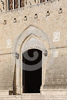 Siena, SI, Italy - February 20, 2023: Door of Headquarters of the bank called MONTE DEI PASCHI DI SIENA