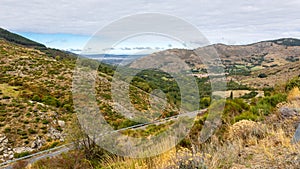 Sierra de Gredos mountain landscape with winding road, Spain. photo