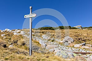 Mountain trail directional signpost in Sierra de Gredos mountains, Spain. photo
