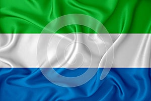 Sierra Leone flag on the background texture. Concept for designer solutions