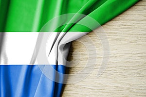 Sierra Leone flag. Fabric pattern flag of Sierra Leone. 3d illustration. with back space for text