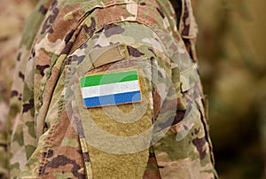 Sierra Leone flag on soldiers arm. Sierra Leone troops collage