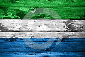 Sierra Leone flag on wooden planks background