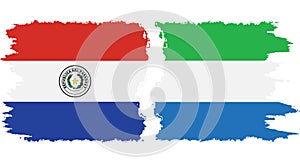 Sierra Leone and Paraguay grunge flags connection vector