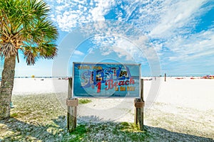 Siesta Beach sign on a clear day