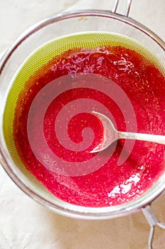 Sieving raspberry puree