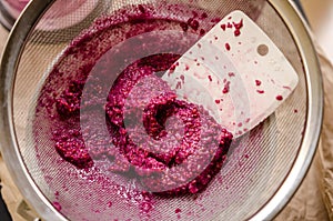 Sieving raspberry puree