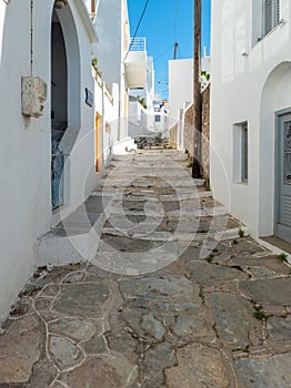 Sifnos island, Apollonia village Cyclades Greece. Buildings empty alley and stairs. Vertical