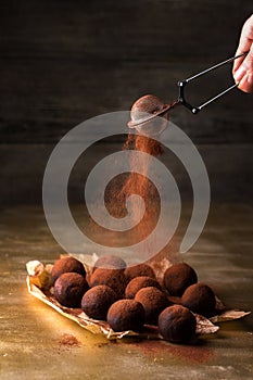 Sift cocoa through a sieve photo