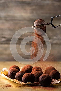 Sift cocoa in truffles photo