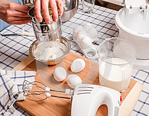 Sift flour man, standing behind a table