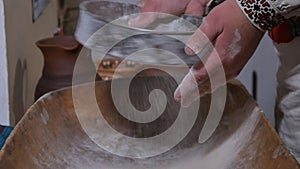 Sift flour through a sieve